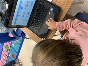 First grader using Chromebook.
