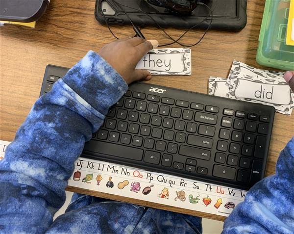 Typing in our sight words using a real keyboard.